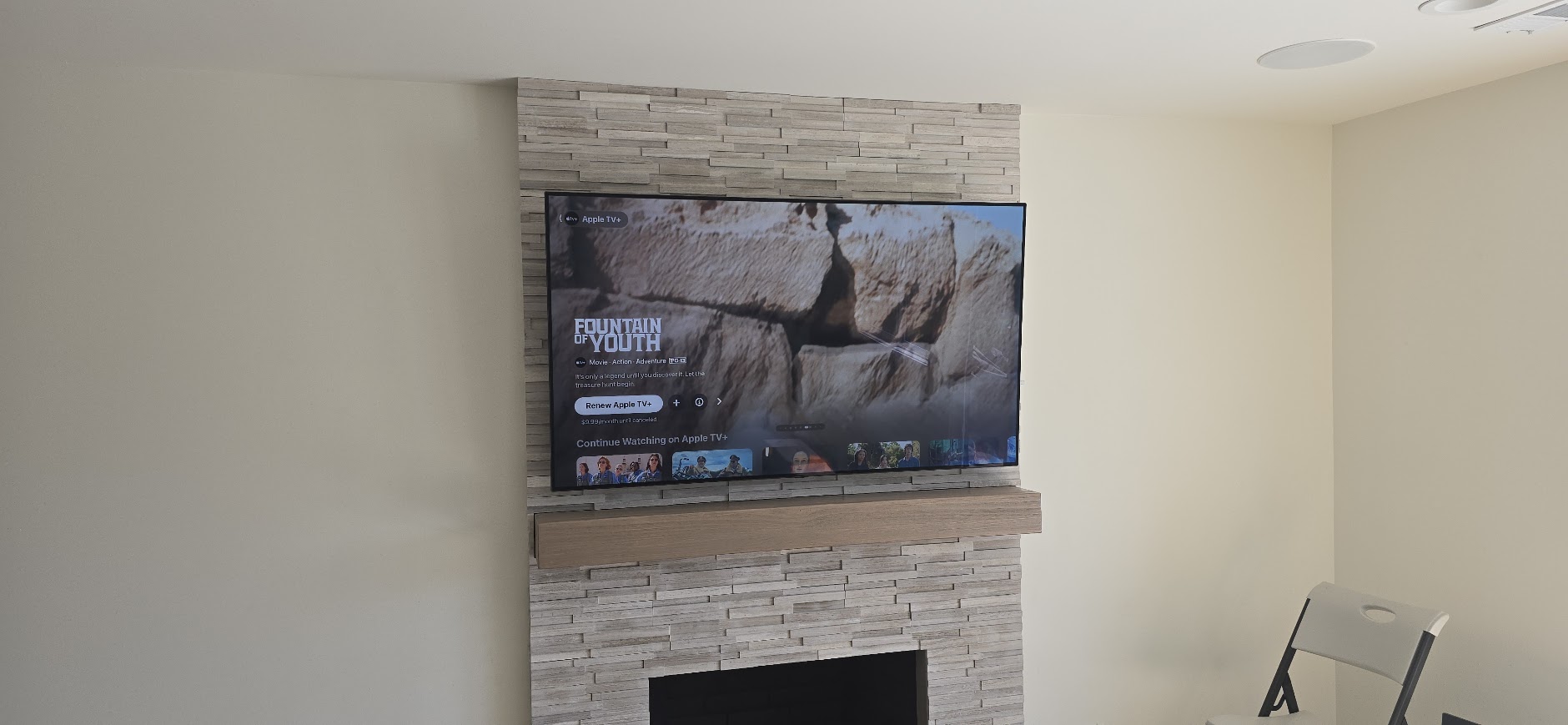 TV on a stone fireplace